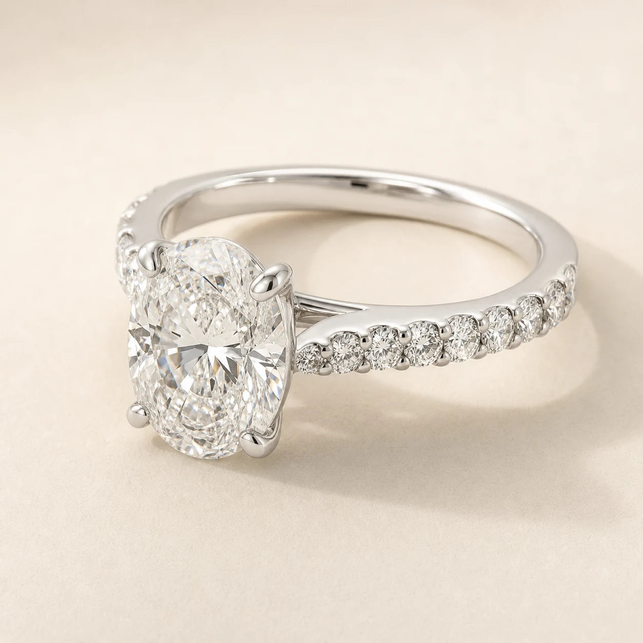 Oval lab-grown diamond engagement ring with a white-gold shared-prong diamond band
