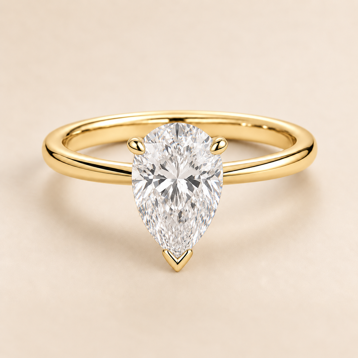Pear solitaire engagement ring in Yellow Gold — front view