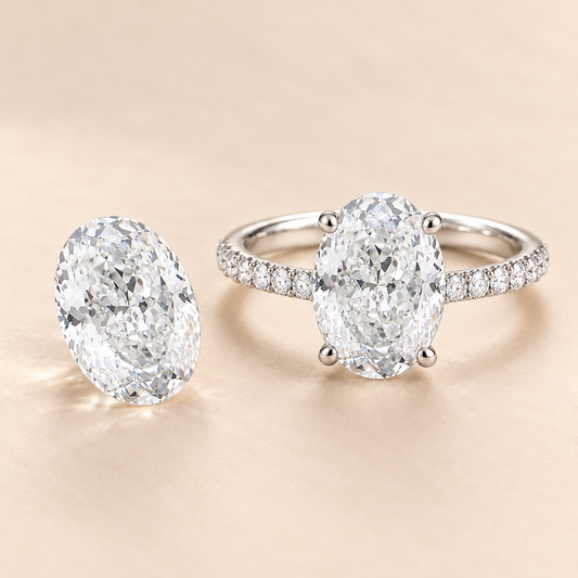 Illustrative Oval Portuguese cut loose diamond beside matching finished ring