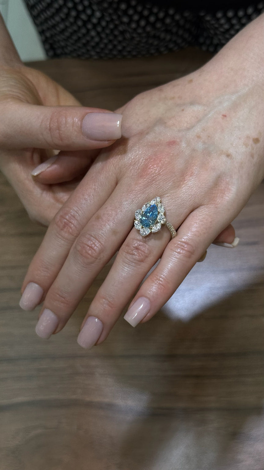 Custom blue pear diamond ring by FERE Jewelers