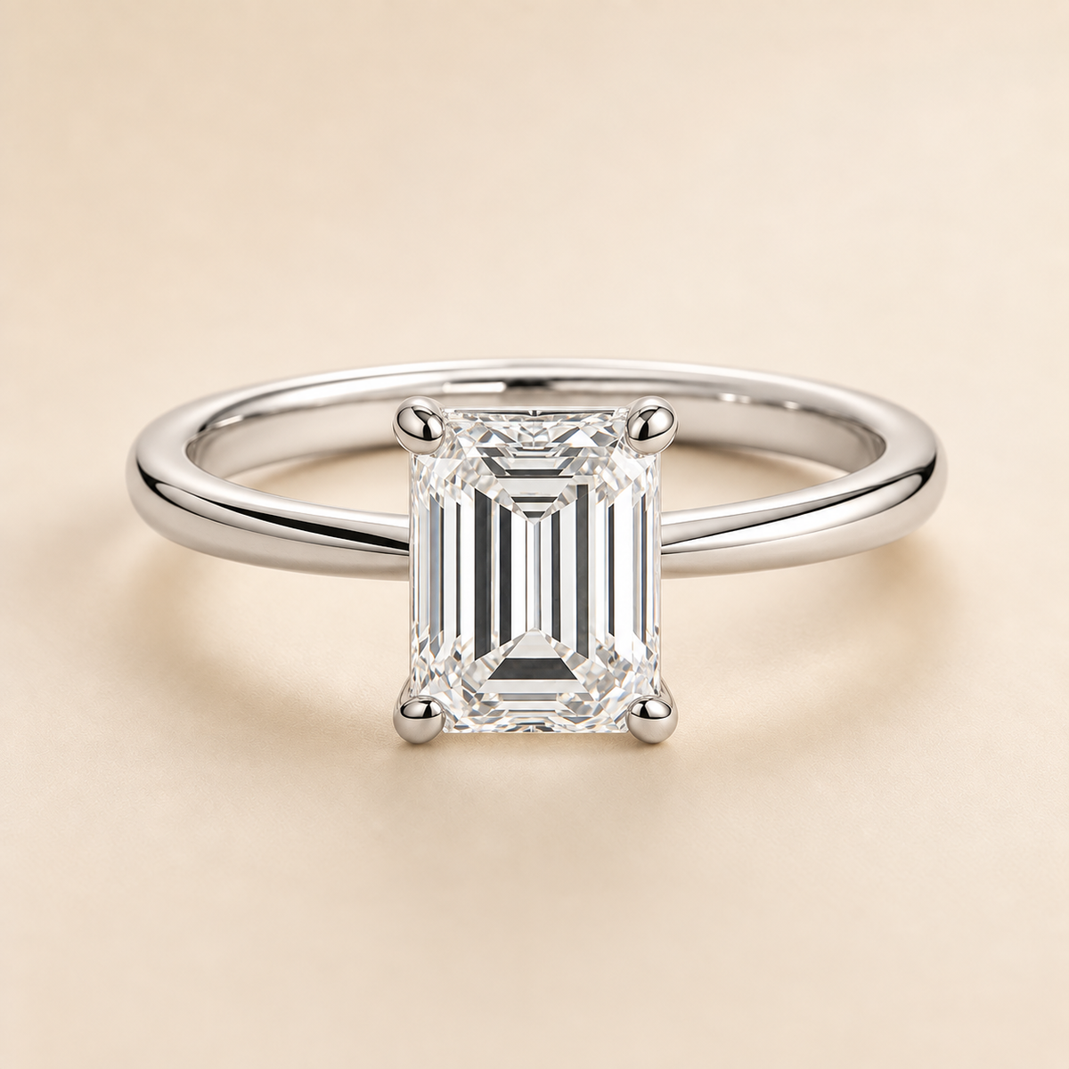 Emerald solitaire engagement ring in White Gold — front view