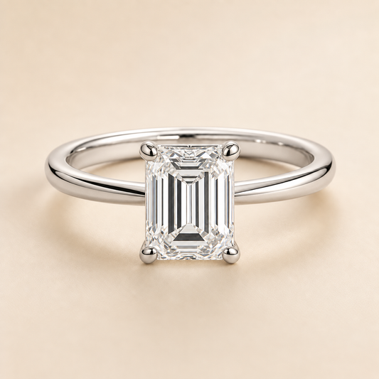 Emerald solitaire engagement ring in White Gold — front view