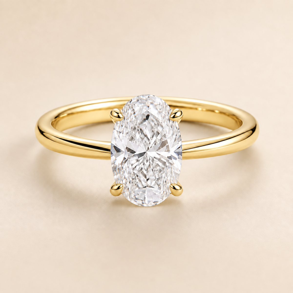 Oval solitaire engagement ring in Yellow Gold — front view