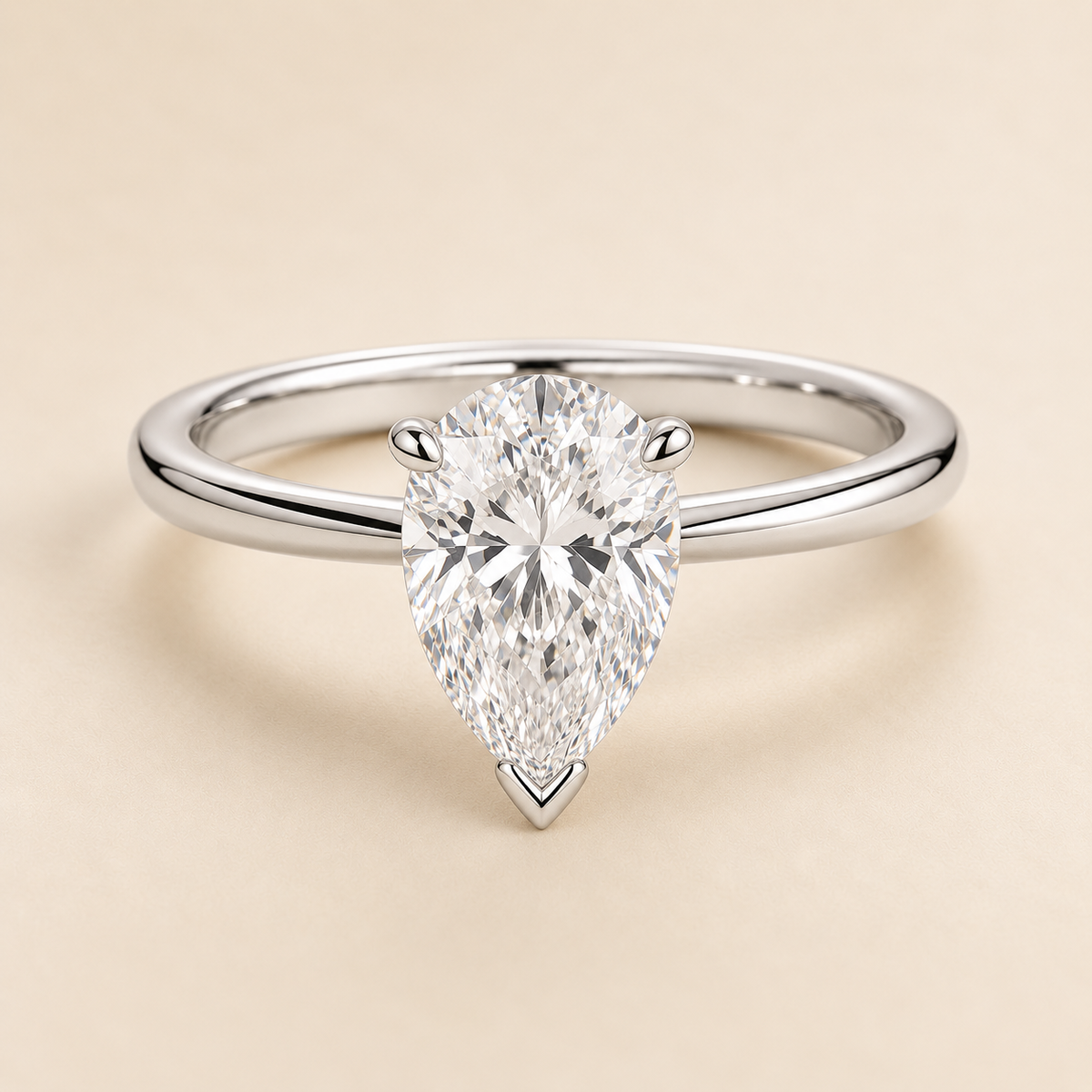 Pear solitaire engagement ring in White Gold — front view